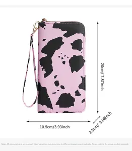 Pink cow print wallet dimensions 20x10.5x2.5cm with zipper and wrist strap detail