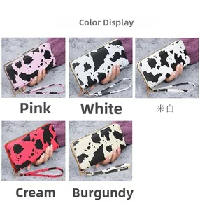 Collection of cow print zipper wallets in pink, white, burgundy and khaki with wristlet
