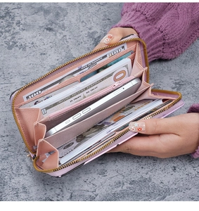 Detail view of pink long wallet interior with multi-functional card slots and zipper pocket