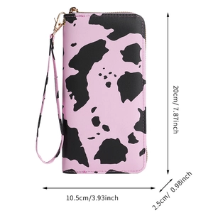 Detailed view of cow print wallet dimensions 20x10.5x2.5 cm with wrist strap