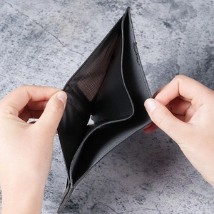 Slim black men's leather wallet with eagle pattern and dual banknote compartments