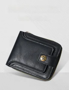 Macro shot of vintage black leather men's wallet with star snap button and zipper closure
