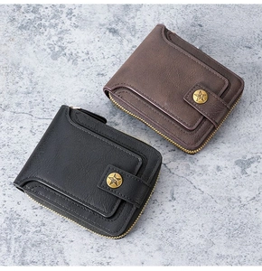Detail view of vintage men's wallet with lychee leather texture and star emblem button