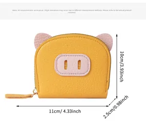 Detailed size view of yellow piglet wallet with dimensions 11x10x2.5cm in inches