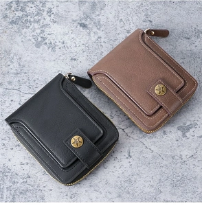 Detail view of vintage short zip wallets in black and brown faux leather with star buckle