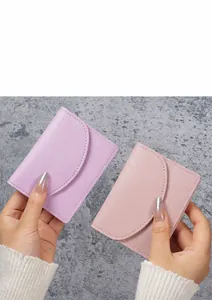 Close-up of minimalist purple and pink PU leather wallets with fine stitching detail