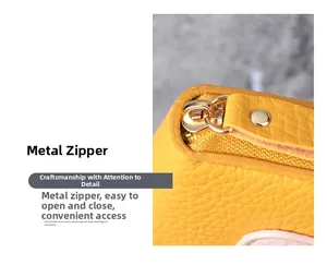 Close-up of yellow pebbled leather wallet featuring smooth golden zipper and leather puller