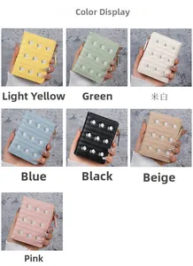 Detailed view of quilted wallets with small floral embroidery in seven vibrant colors