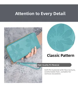 Détail du motif floral gaufré vintage sur le portefeuille en cuir PU à double zip