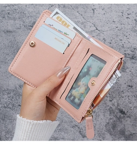 Detail view of pink PU leather wallet interior with card slots, ID window, and zipper pocket