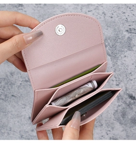 Pink PU leather mini wallet detail showing multiple card slots and magnetic button