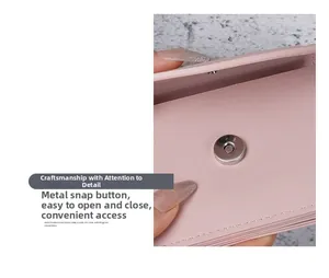 Macro view of light pink cross-grain leather wallet with a silver magnetic snap closure