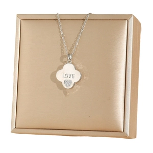 Silver-toned clover necklace with LOVE engraving and heart-shaped zircon on jewelry box