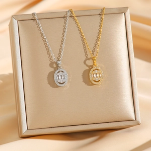 Elegant gold and silver oval geometric necklaces with zircon pendants on satin