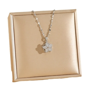 Rotating zircon clover flower pendant necklace on gold silk texture jewelry gift box