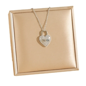 Silver heart padlock necklace with white rhinestones and DIO script on luxury box