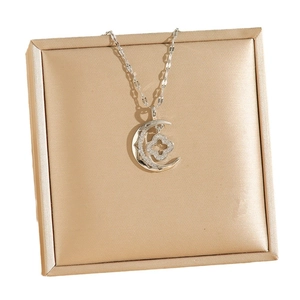 Sparkling moon and four-leaf clover pendant necklace with zircons on elegant jewelry box