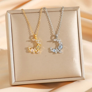 Elegant gold and silver crescent moon necklaces with opal and zircon on silk