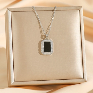 18K gold plated titanium necklace with crystal pavé and black geometric pendant