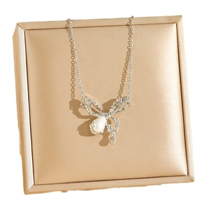 Elegant silver butterfly necklace with teardrop pearl on a champagne satin jewelry box