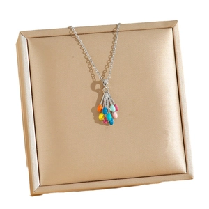 Colorful balloon cluster necklace with silver chain in a champagne gold jewelry box