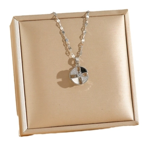 Rotating windmill pendant necklace in silver with black and white enamel and crystals
