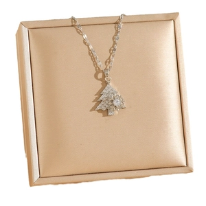 Rotating snowflake Christmas tree necklace with sparkling pavé cubic zirconia