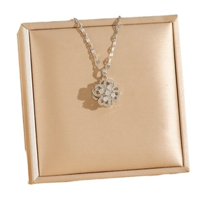 Titanium steel rotating clover pendant necklace with sparkling cubic zirconia pavé