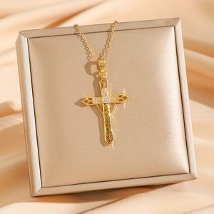 Gold-plated hollow sword cross necklace with diamonds and moire pattern on satin