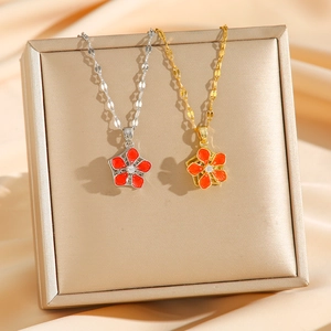 Rotating enamel flower necklace with zircon pendant in gold and silver finish