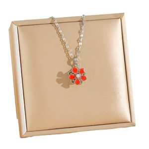 Titanium steel necklace with rotating red enamel flower pendant and zircon stone