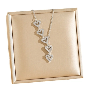 Elegant silver titanium steel necklace featuring five sparkling crystal-encrusted heart pendants