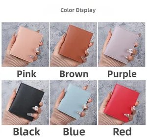 Compact leather card holder available in pink, brown, purple, black, blue, and red colors