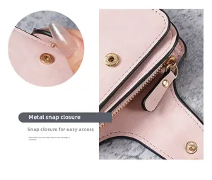 Detail view of pink leather wallet with secure gold snap button and smooth metal zipper