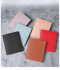 Flat lay of colorful slim card holders showing diverse textures and stitching details