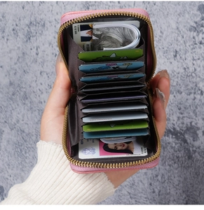 Pink zip-around card wallet with accordion slots and RFID protection for women