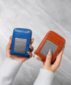 Close-up of blue and tan pebble grain leather card wallets with clear ID windows