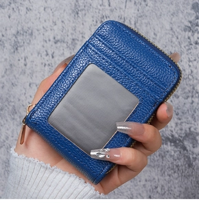 Blue litchi leather card holder with clear ID window and secure gold zipper detail