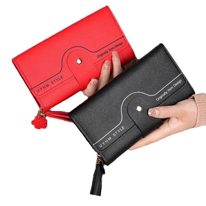 Three-fold long wallet for women with tassel charm in burgundy and black faux leather