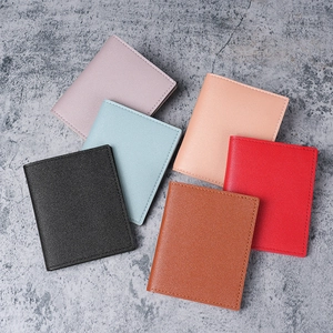 Slim women's card holder wallet with pebble grain texture in six vibrant colors