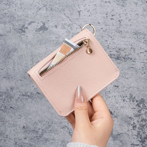 Pink lychee grain leather card holder with gold zipper and metal ring for women