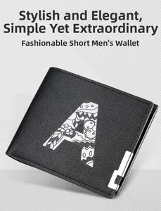 Detail of black bifold leather wallet with textured lychee grain and artistic letter A