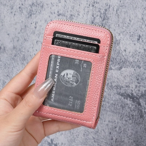 Pink lychee grain leather zip card holder with multi-slot design and transparent window