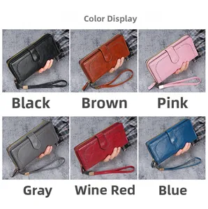 Multiple colors of women's oil wax PU leather long wallets with wrist straps and zip closure