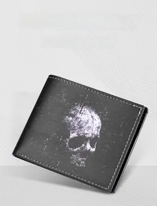Close-up of black vintage skull print wallet with white contrast stitching detail