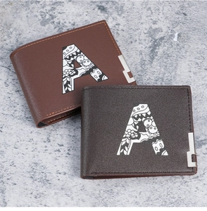 Detail of brown men's bifold wallet showing letter A with floral mandala and silver buckle