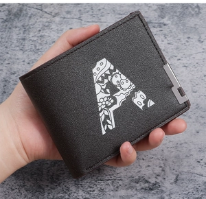 Macro detail of men's brown bifold wallet with floral letter A print and metal edge
