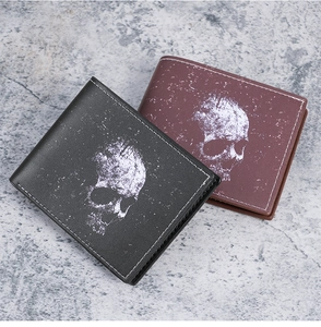 Close-up of skull print short wallets with contrast stitching on vintage stone background