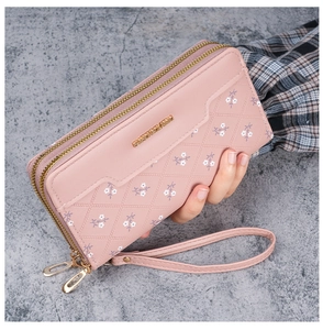 Pink floral faux leather long wallet with double zipper and wrist strap detail