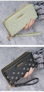 Detailed close-up of long zip wallets with quilted floral patterns and wrist straps